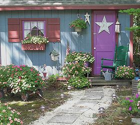 my fairy tale style shed, flowers, gardening, outdoor living, Here is the shed in full bloom See what Miracle Grow can do I love that stuff
