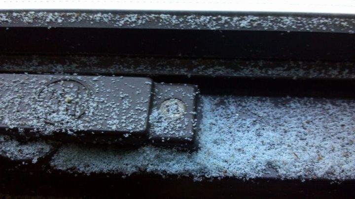 what is this mysterious blue powder that keeps collecting on the inside of our window, We have noticed this blue fluff on the latch and above