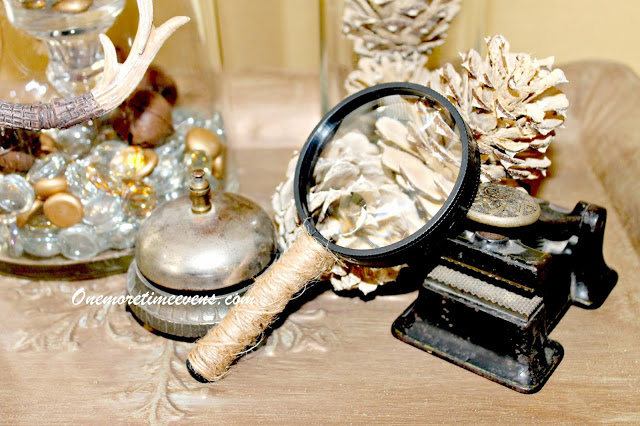 masculine christmas vignette with a touch of elegance, crafts, seasonal holiday decor, Small Antique bell hop bell and Antique Embosser with a twine wrapped magnifying glass