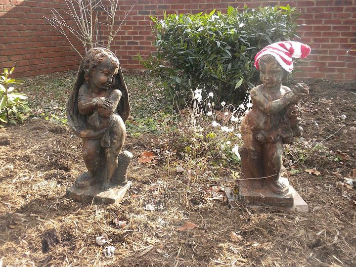 home for the holidays tour 2013, christmas decorations, seasonal holiday decor, wreaths, Two of four seasonal statuary in the garden In this photo Spring is sporting a stocking hat
