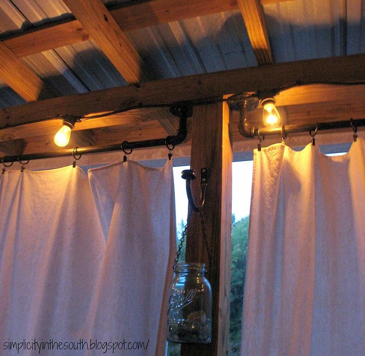 how to make curtain rods from plumbing parts, outdoor living, porches, reupholster, window treatments, DIY curtain rods string lights and drop cloth curtains for a covered porch