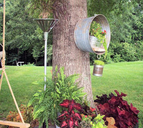 repurposed junk garden, I ran out of space in this tree circle so MWHP My Wonderful Hubby Phil had the idea to move the washtub up way up on the tree itself