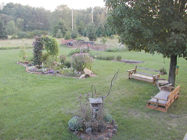 tjndb hl habitat gardens, flowers, gardening, outdoor living, Same year back yard shot with benches that I picked up curbside They were couch frames with cushions