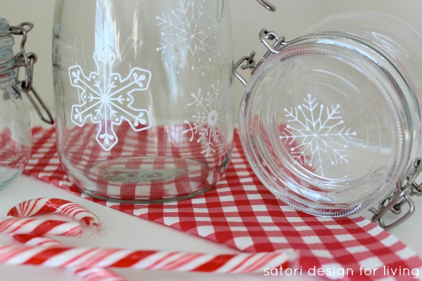 diy snowflake glass canisters, crafts, seasonal holiday decor, Use different stencils to create a collection of jars