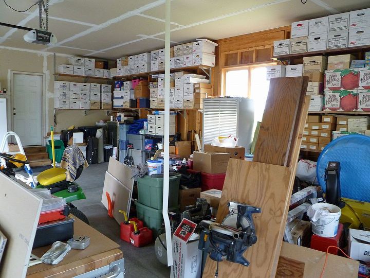 garage makeover from trash to treasure, cleaning tips, garages, You can see it s getting a little better as we sorted boxed and labeled it all