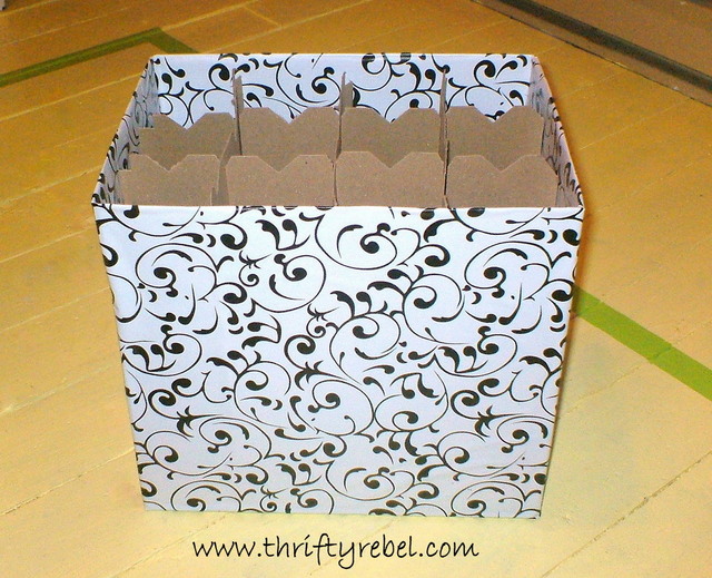liquor store cardboard box makeover, crafts, repurposing upcycling, storage ideas, Here s one I covered with self adhesive contact paper I ll probably be keeping some rolled up fabrics in this one