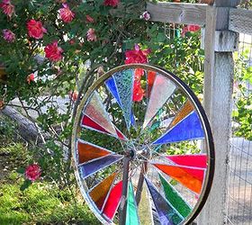 marie s stained glass garden spinner, crafts, gardening, repurposing upcycling, Marie mounted this in the garden using the bike forks themselves