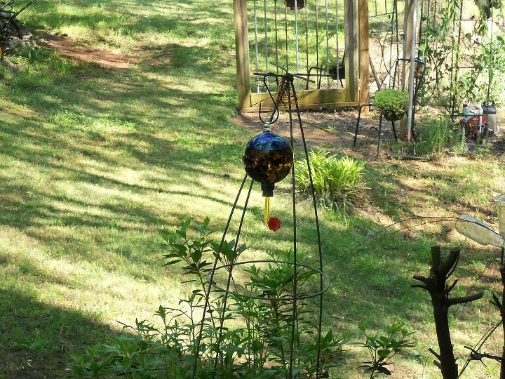 happy mother s day, flowers, gardening, upside down tomato cage in large flower pot as a hanger for humming birds they rest on the wires of the cage
