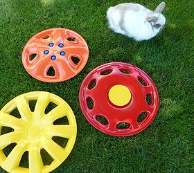 hubcap flower yard art, crafts, flowers, gardening, painting, Spray paint hubcaps in fun colors Use things you have to add interest spray a plastic lid for the center of a flower use tongue depressors for a design