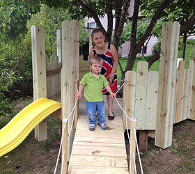 diy build your kids a play castle, diy, outdoor living, woodworking projects, We added a slide and a ramp on the downhill side of the castle