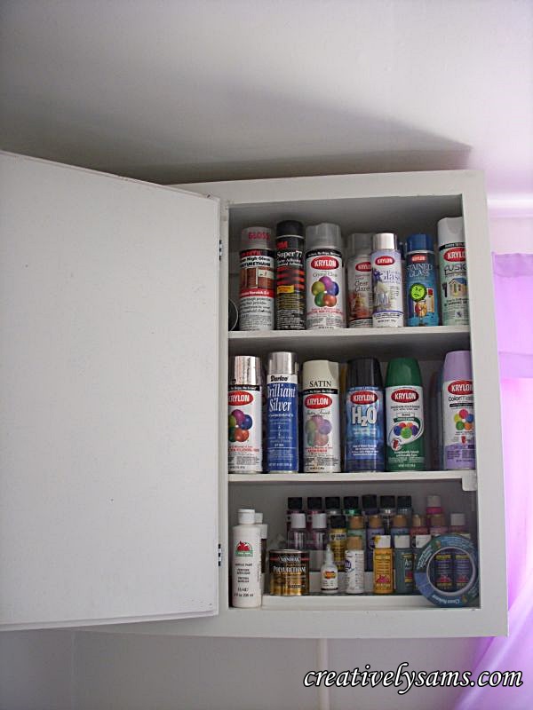 sewing craft room cabinet re do, kitchen cabinets, painted furniture, The right side holds all of my spray paints 4 cans deep