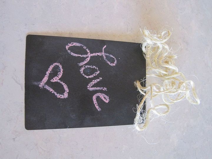 repurpose countertop samples into chalkboard tags, chalkboard paint, crafts, Then season your chalkboard tag by rubbing the entire piece with the side of the chalk then wipe it clean and draw any design you want