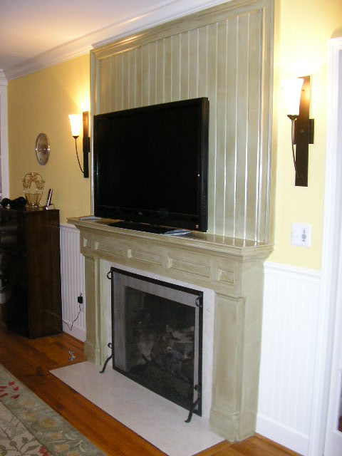 home renovation fireplace, fireplaces mantels, home decor, After Photo of fireplace TV new wall sconces beadboard
