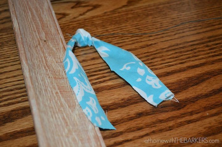 how to make a framed fabric garland, crafts, Tie fabric in a knot onto the wire