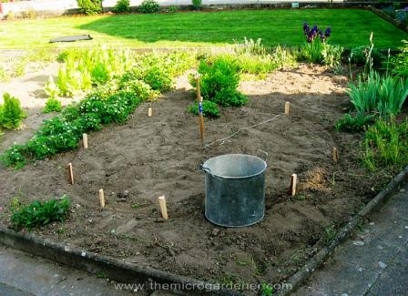 how to build a herb spiral garden, diy, flowers, gardening, homesteading, how to, perennial, Measuring the circle pond position with a string stake in the center