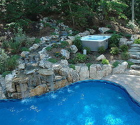 integrating a portable spa into a backyard oasis, landscape, outdoor living, ponds water features, pool designs, spas, Spa Landscaping Design Boulders and plants soften the look of the integrated spa charming upper patio and stepping stone path add to the natural look