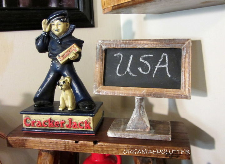 patriotic kitchen vignette, patriotic decor ideas, repurposing upcycling, seasonal holiday d cor, A reproduction Cracker Jack door stop borrowed once from my Mom for a dog vignette also worked