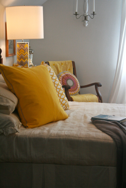 a yellow and gray master bedroom, bedroom ideas, home decor, Yellow and Gray pillows add a pop of color to my BLAH bedroom