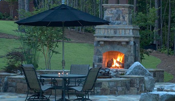 stone patio and fireplace fun geo meteric design of two concentric circles, outdoor living, patio, ponds water features