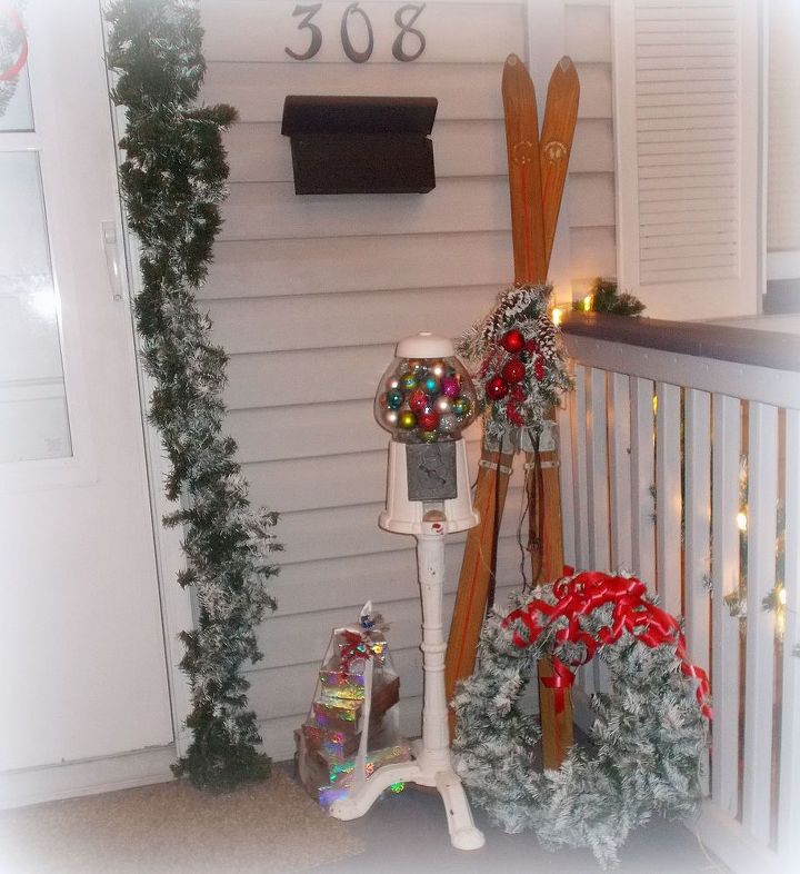christmas porch, curb appeal, porches, seasonal holiday decor, Old skis and a Gumball Machine