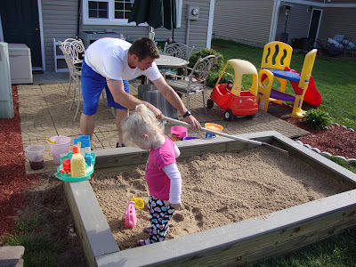 diy sandbox, outdoor living, woodworking projects, Raking and adding of 35 bags of sand