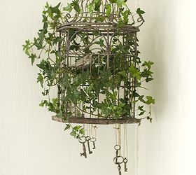 before amp after of the livingroom, home decor, living room ideas, and another detail birdcage with greens and hanging skelleton keys
