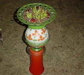 repurposed glass, Orange yard totem planter with an orange tipped Campfire Plant in the green bowl Glass redefined and assembled by Nita Hooper