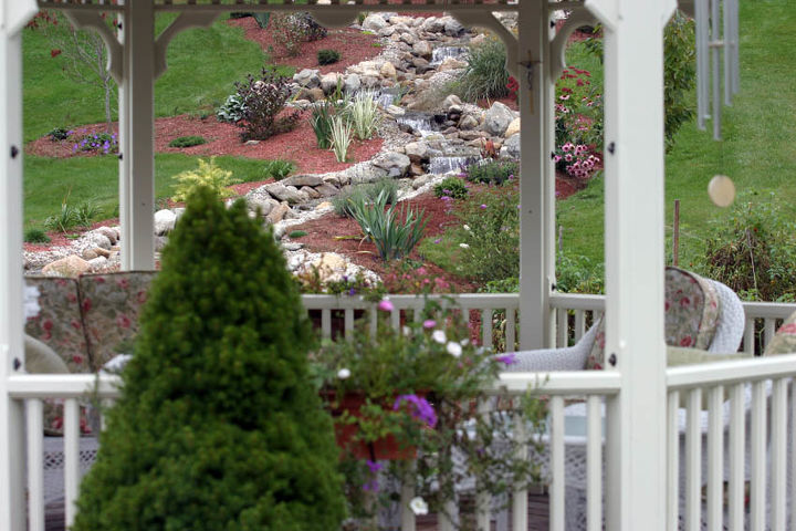 gazebos and ponds some things just go together, gardening, outdoor living, ponds water features, A view of the meandering waterfall from inside the gazebo