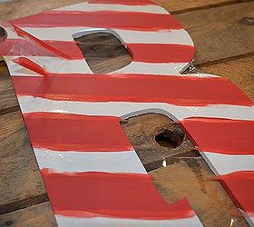 candy cane initialed holiday wreath, crafts, painting, seasonal holiday decor, wreaths, Once the paint is dry peel back the tape