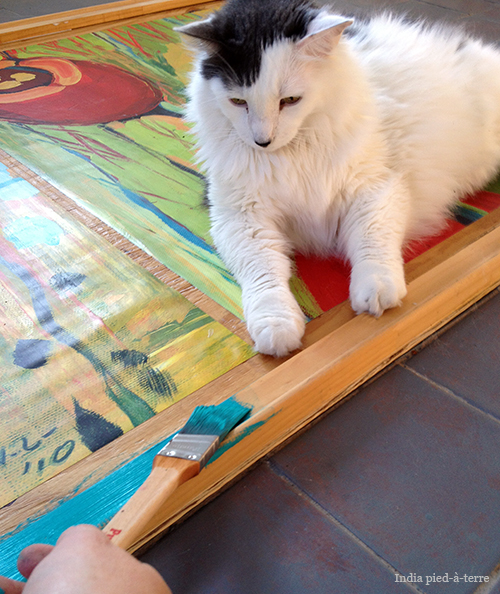 how to frame huge prints inexpensively, diy, how to, painting, wall decor, woodworking projects, I painted the frame turquoise and painted the exposed plywood backing a lime color This step requires very close supervision by Crafty Cat I think I did okay