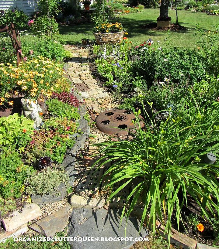 using salvaged brick in the flower border, flowers, gardening, repurposing upcycling, Here bricks form a pathway down the center of her border