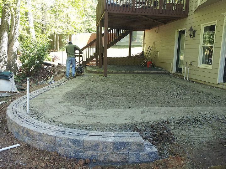 back yard patio challenge, concrete masonry, decks, outdoor living, patio, retaining wall first runs Compacting the surface with a vibrator compactor
