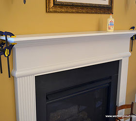 a simple solution to gain more space on your mantle, seasonal holiday decor, We attached the painted board to the existing mantle using Elmers Carpenters Glue and left the clamps in place overnight