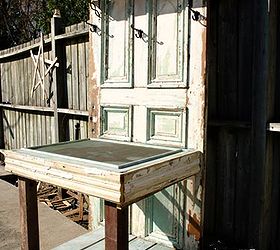 potting tables from random bits, gardening, painted furniture, repurposing upcycling, An old door some old trim and molding an old screen and some fence boards Voila Using a screen for your potting table really helps when it comes to rinsing it off or collecting spilled soil or excess water