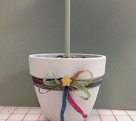 hometalk diy spring topiary inspiration, crafts, seasonal holiday decor, I decided that the plain white pot needed some embellishment I had the hand dyed silk ribbon on hand and then added the little star button