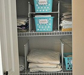 this hack will keep your linen closet organized for good, closet, shelving ideas, Slide in your baskets linens towels etc into their designated homes Appreciate that they can t canoodle with the pile next door Everything has a place and with these dividers they will stay there