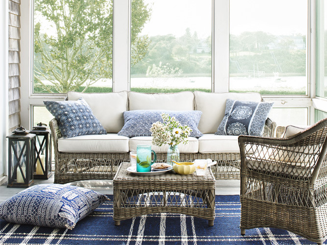 house tour righting the ship, home decor, Wicker furniture gives this enclosed porch a laid back look The windows were left undressed to take full advantage of the view the blue palette echoes the water beyond Shop the sunroom