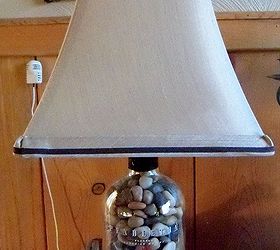 how to repupose a pendleton whiskey bottle, repurposing upcycling, Filled with polished rocks added a tan with brown trim shade Nice lamp