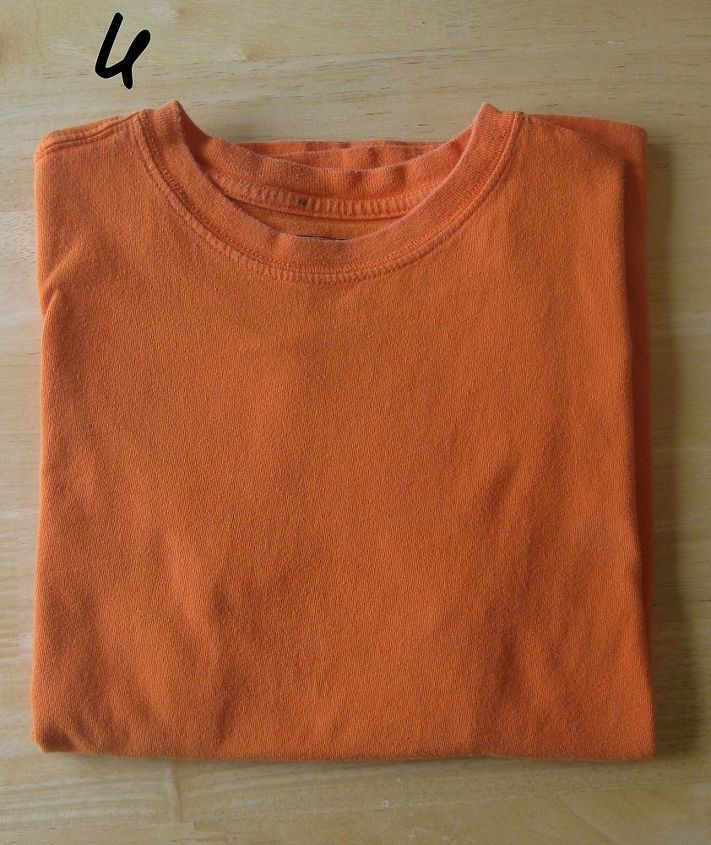 how to fold and organize your t shirts, organizing, Fold the tee in half