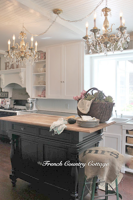 french country cottage kitchen, A cupboard door was taken off for open shelving on each end of the upper cupboard and 4 drawers became baskets on one side of the sink and 4 drawers became an area for a dishwasher on the other side of the sink