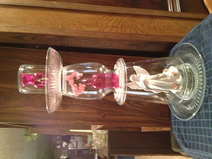 garden totem poles bird feeders, crafts, Pink This is 20 tall10 wide A white pink angel is on the bottom encased with a clear glass vase The middle layer has a hot pink miniature vase flowers The top is a hot pink bottle with a top underneath is a glass plate Very Victorian
