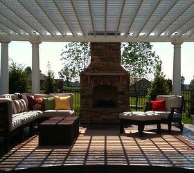 creating a gorgeous outdoor space, decks, outdoor living, Pergola and outdoor chimney with outdoor sectional and all weather wicker coffee tables