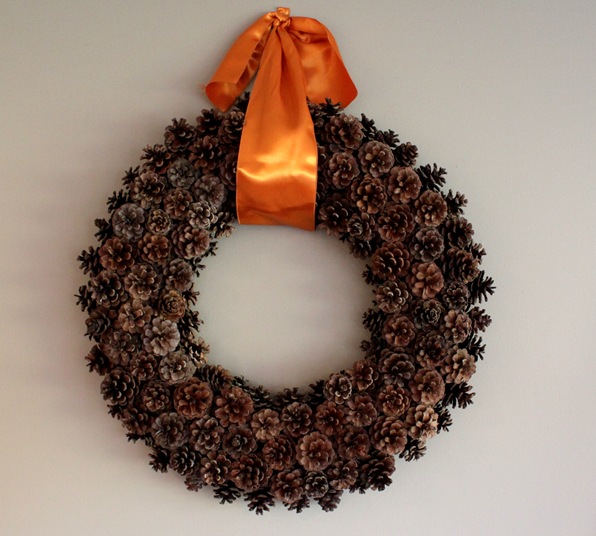 free pinecone wreath, crafts, seasonal holiday decor, wreaths, Adding a large satin ribbon seems to pull everything together