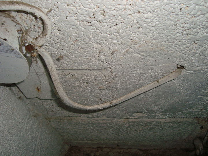 q i have posted 2 pictures of a problem i need to correct regarding an outside, electrical, garages, this is the wire coming out of a junction box I guess that is what you call it and passing through the wall to the outside