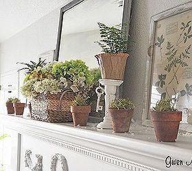 how to bring the colors of spring into your room, seasonal holiday d cor, a few baby ferns and pots of moss on the mantel are next to thrift store botanticals propped against the wall