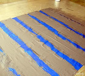 diy painted floor cloth, flooring, painting, When painting fabric t s best to go with a flat finish paint I used Valspar s Volcanic Ash for this project and applied it with a paint roller You ll need about 2 coats and be sure to let it dry between applications