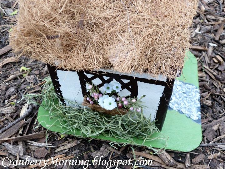 making a medieval peasant cottage easy and fun, crafts, The moss was also hot glued on The whole house was hot glued onto the base and the base painted green The chimney was a piece of black cardstock about 3 inches long folded into a rectangular prism and glued in place Paint stones