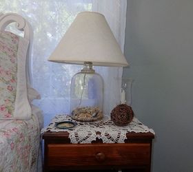 my vintage beach inspired and very thrifted guestroom is done, bedroom ideas, home decor, This is an old glass gallon milk jug I put sea glass and shells and bought a lamp kit The shade was free