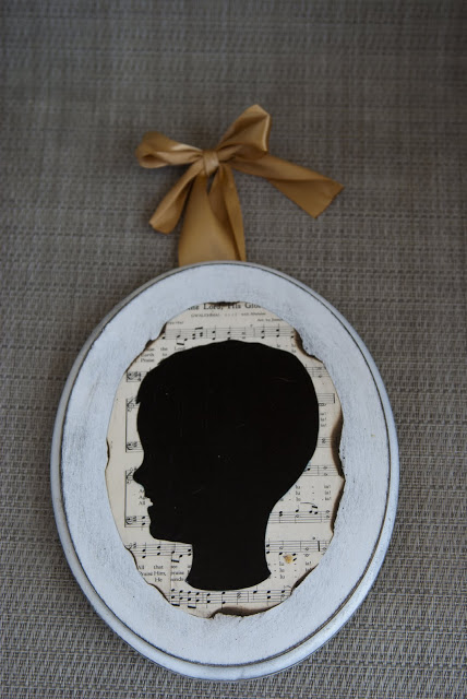 make child silhouette plaques, crafts, One of the finished plaques