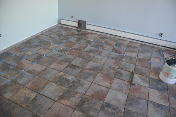 porcelain floor tile, flooring, kitchen backsplashes, tile flooring, tiling, tile being installed in living room